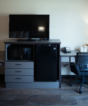 The Lodge at Moorcroft suite with TV and desk